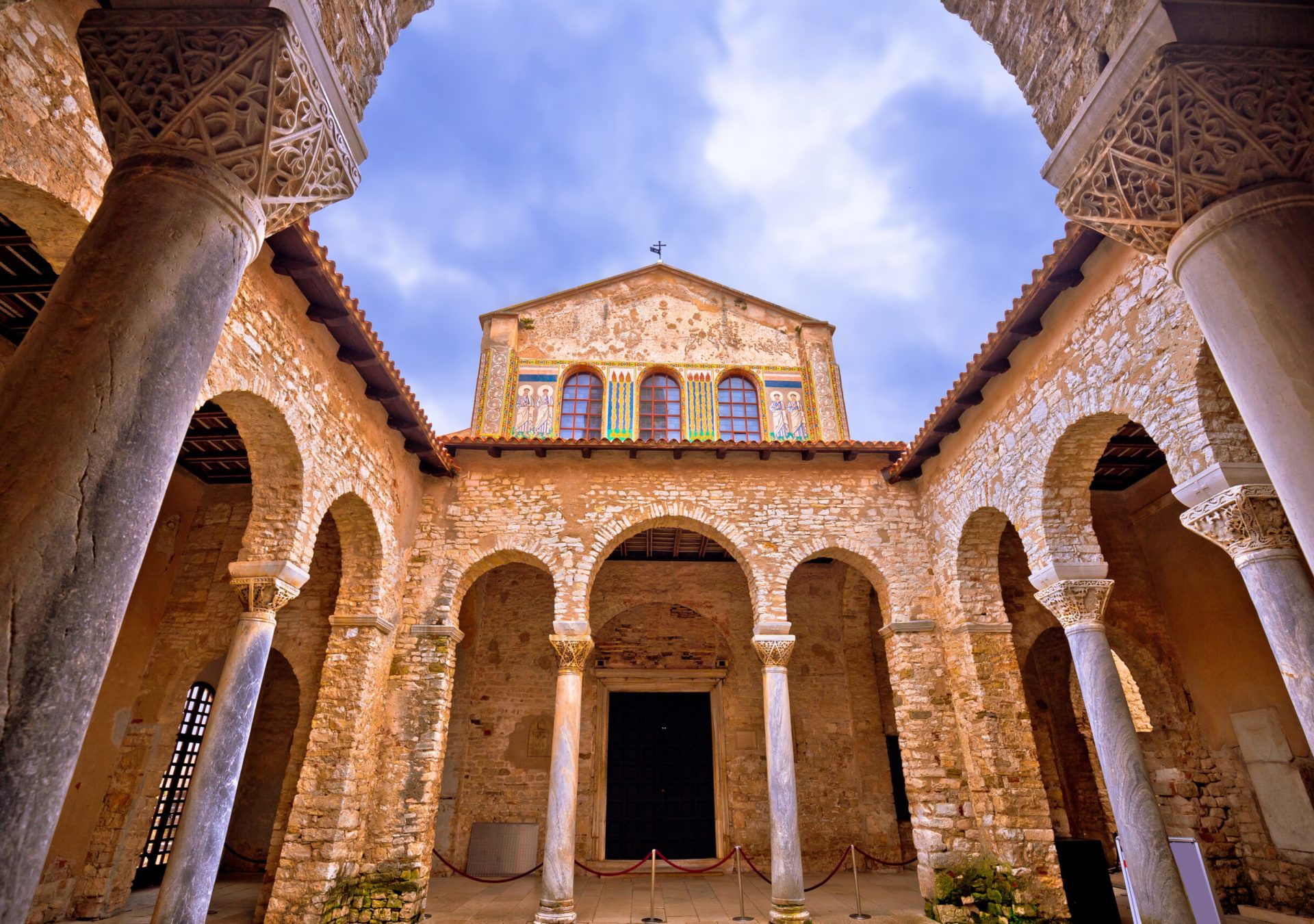 Euphrasian Basilica in Porec arcades and tower view, UNESCO world heritage site in Istria, Croatia